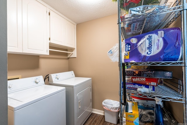 204 Riverside Dr, Pangburn, AR 72121 - laundry area featuring washer and dryer, cabinet space, dark wood finished floors, a textured ceiling, and baseboards
