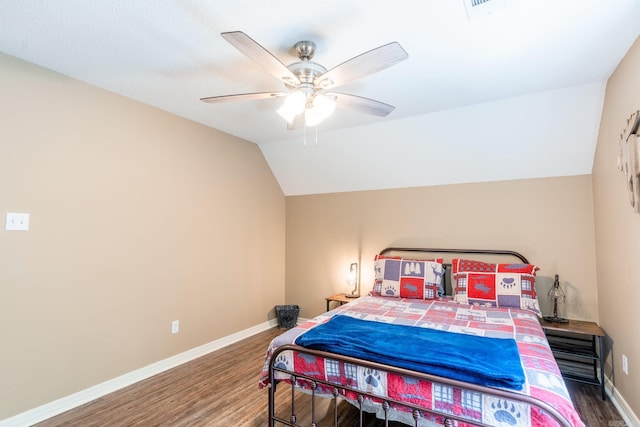 204 Riverside Dr, Pangburn, AR 72121 - bedroom featuring wood finished floors, vaulted ceiling, baseboards, and a ceiling fan
