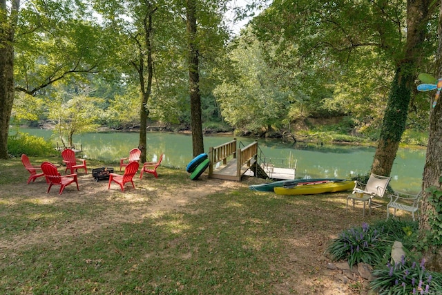 204 Riverside Dr, Pangburn, AR 72121 - view of yard with an outdoor fire pit, a water view, and a boat dock