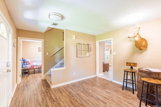 204 Riverside Dr, Pangburn, AR 72121 - foyer with light wood-style flooring, stairs, and baseboards