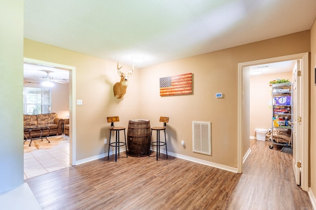 204 Riverside Dr, Pangburn, AR 72121 - living area featuring wood finished floors, ceiling fan, and baseboards