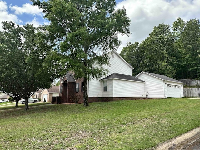 view of side of property featuring an attached garage