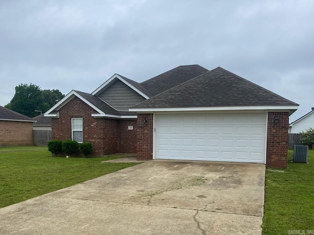 ranch-style home featuring brick siding, driveway, a shingled roof, an attached garage, and central AC