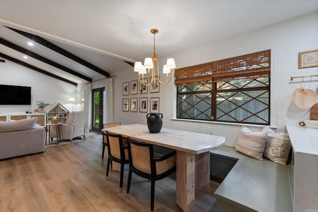 dining space featuring a chandelier and wood finished floors