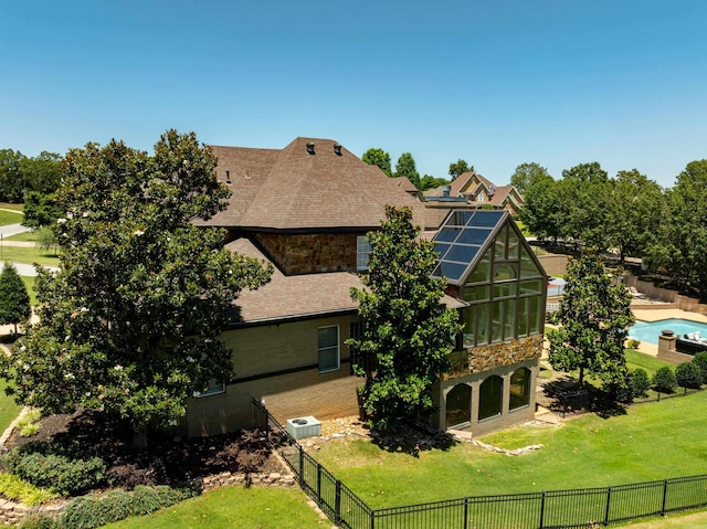 3625 Riviera Dr, Jonesboro, AR 72404 - rear view of property featuring a shingled roof, stone siding, an exterior structure, and an outbuilding
