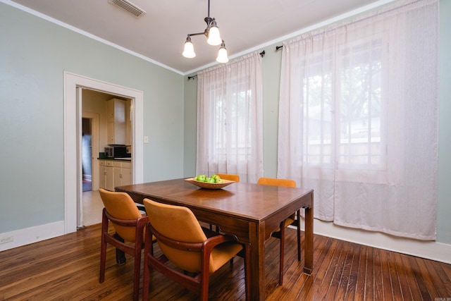 5200 I St, Little Rock, AR 72205 - dining room with dark wood-style floors and crown molding