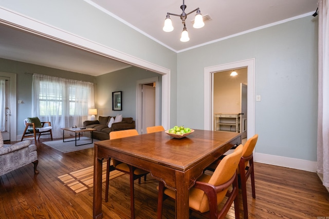 5200 I St, Little Rock, AR 72205 - dining space with wood finished floors, crown molding, baseboards, and a chandelier