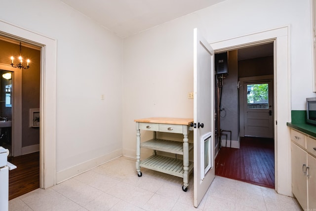 5200 I St, Little Rock, AR 72205 - corridor with a chandelier and baseboards