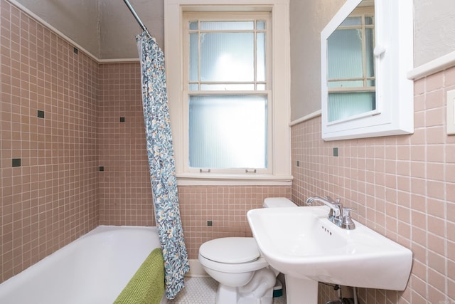 5200 I St, Little Rock, AR 72205 - bathroom featuring tile walls, toilet, shower / bath combo, and a sink