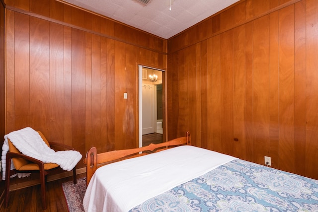 5200 I St, Little Rock, AR 72205 - bedroom featuring wooden walls and wood finished floors