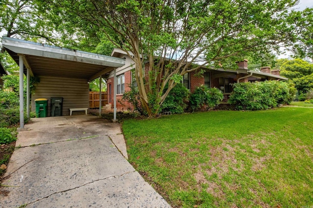 5200 I St, Little Rock, AR 72205 - view of front facade with driveway, brick siding, and a chimney