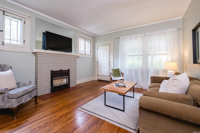 5200 I St, Little Rock, AR 72205 - living area with wood-type flooring, crown molding, a brick fireplace, and baseboards
