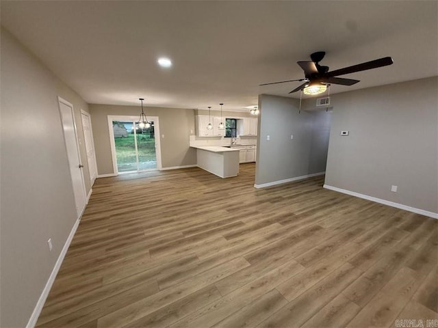 3705 E 6th St, Russellville, AR 72802 - unfurnished living room featuring baseboards, wood finished floors, a ceiling fan, and recessed lighting