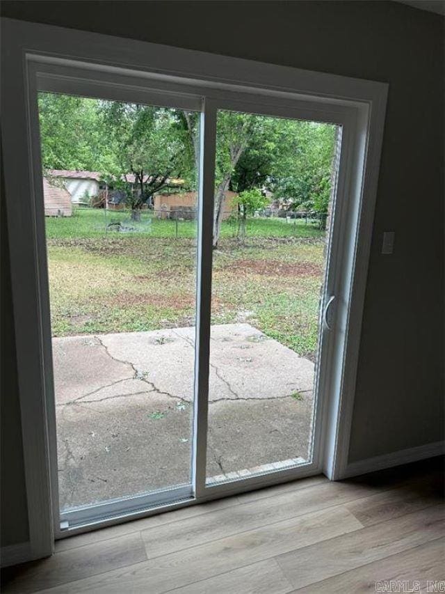 3705 E 6th St, Russellville, AR 72802 - doorway to outside with plenty of natural light, baseboards, and light wood finished floors