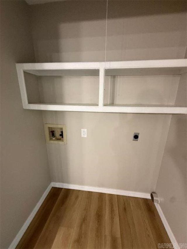 3705 E 6th St, Russellville, AR 72802 - laundry room featuring electric dryer hookup, washer hookup, dark wood-style flooring, and baseboards
