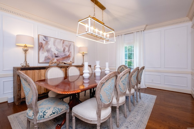 dining area featuring a decorative wall, a chandelier, and dark wood-style flooring