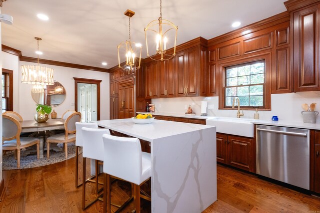 kitchen with stainless steel dishwasher, a chandelier, a sink, light countertops, and recessed lighting