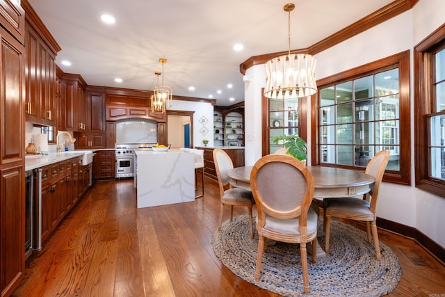 dining area with a chandelier, dark wood finished floors, ornamental molding, recessed lighting, and baseboards
