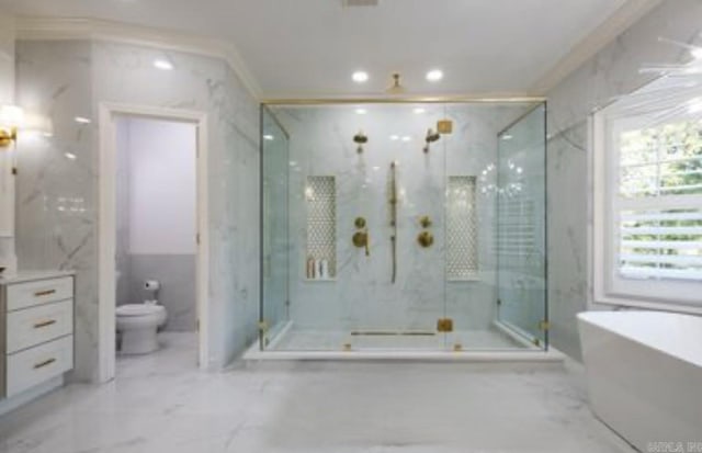 bathroom with marble finish flooring, a marble finish shower, a soaking tub, toilet, and recessed lighting