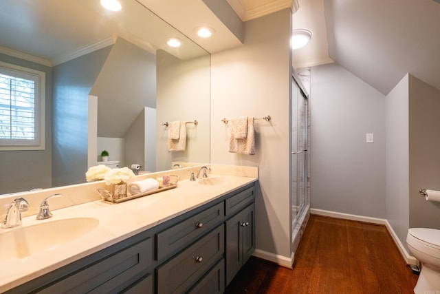 full bathroom with toilet, ornamental molding, wood finished floors, a stall shower, and vaulted ceiling