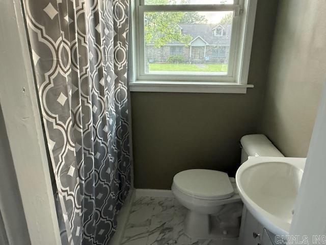 307 E 5th St, Carlisle, AR 72024 - full bath with toilet, marble finish flooring, a shower with shower curtain, and vanity