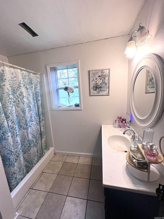 320 E 5th St, Rector, AR 72461 - full bathroom featuring tile patterned flooring, baseboards, vanity, and a shower with shower curtain