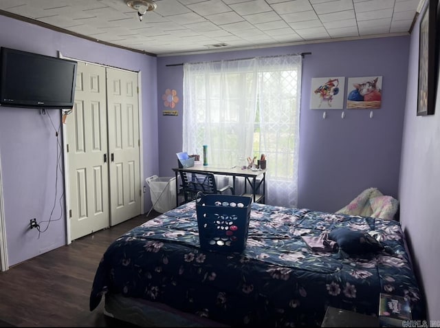 320 E 5th St, Rector, AR 72461 - bedroom featuring crown molding, dark wood-style floors, and a closet