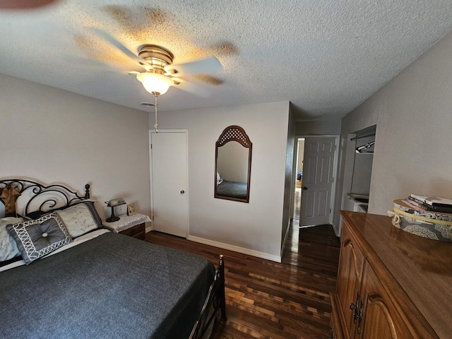 bedroom featuring dark wood finished floors, a textured ceiling, baseboards, and a ceiling fan