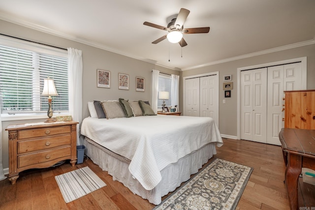3 Tenerife Way, Hot Springs Village, AR 71909 - bedroom with two closets, crown molding, wood finished floors, a ceiling fan, and baseboards