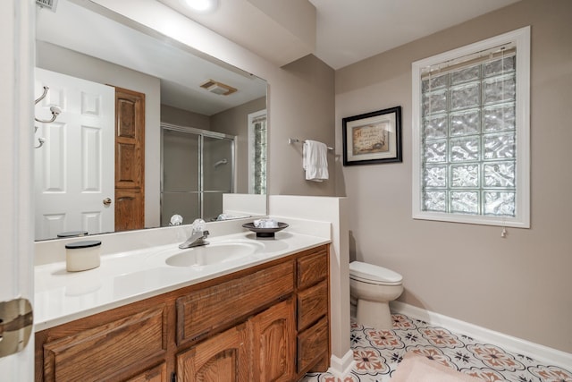 3 Tenerife Way, Hot Springs Village, AR 71909 - bathroom featuring a stall shower, toilet, vanity, baseboards, and tile patterned floors