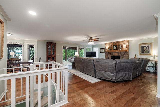 3 Tenerife Way, Hot Springs Village, AR 71909 - living area with crown molding, dark wood finished floors, a ceiling fan, and a stone fireplace