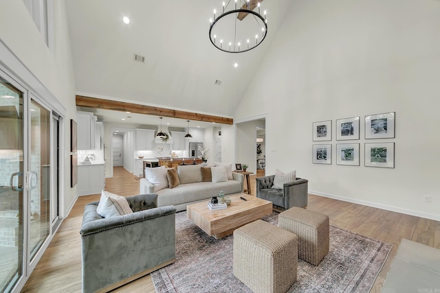living room with high vaulted ceiling, a chandelier, light wood-type flooring, recessed lighting, and baseboards