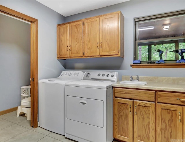 72 Pintuerero Way, Hot Springs Village, AR 71909 - laundry area featuring cabinet space, separate washer and dryer, light tile patterned floors, and baseboards
