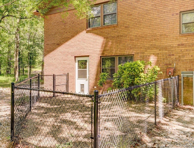 72 Pintuerero Way, Hot Springs Village, AR 71909 - view of side of property with a gate, fence, and brick siding