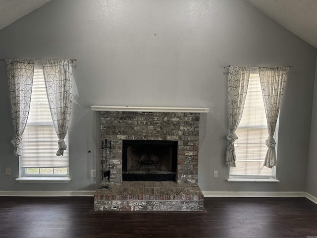 2608 Timbermist Cir, Benton, AR 72015 - detailed view of a fireplace with raised hearth, wood finished floors, and baseboards