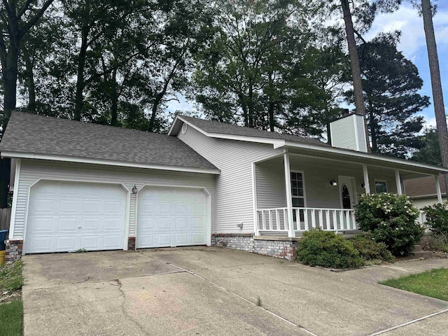 2608 Timbermist Cir, Benton, AR 72015 - view of front of property with an attached garage, covered porch, a chimney, and concrete driveway