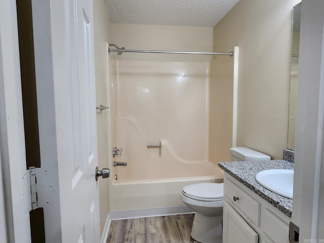 1807 Reservoir, Little Rock, AR 72227 - full bath with vanity, wood finished floors, shower / washtub combination, and a textured ceiling