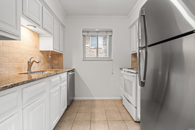 1121 Twin Pts Unit 1121C, Hot Springs, AR 71913 - kitchen featuring appliances with stainless steel finishes, a sink, tasteful backsplash, stone counters, and light tile patterned floors