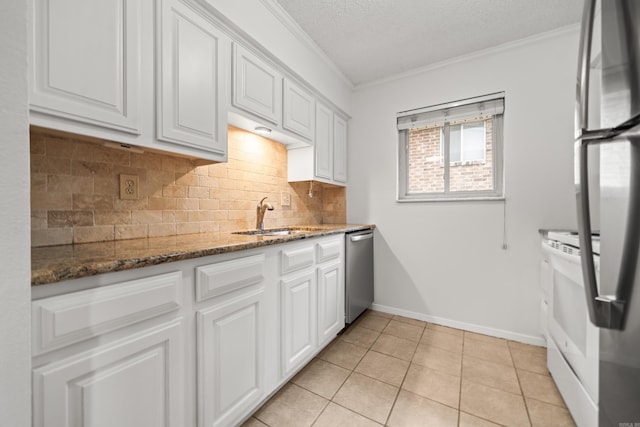 1121 Twin Pts Unit 1121C, Hot Springs, AR 71913 - kitchen featuring a sink, appliances with stainless steel finishes, crown molding, decorative backsplash, and white cabinets