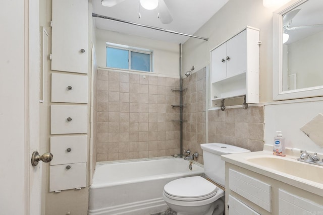 7606 Westwood Ave, Little Rock, AR 72204 - full bath with tile walls, washtub / shower combination, toilet, ceiling fan, and vanity