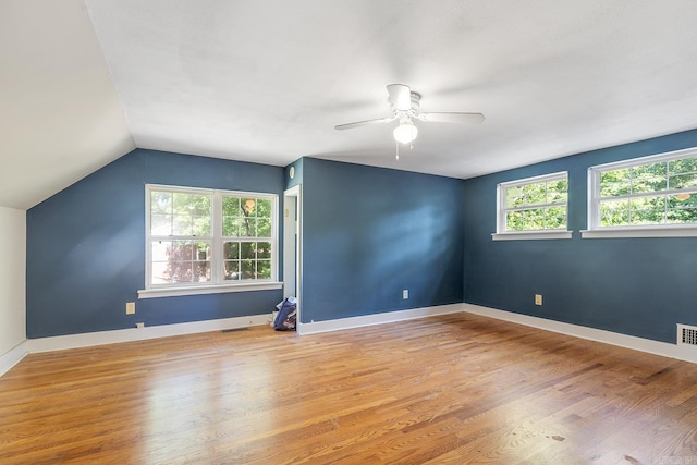 7606 Westwood Ave, Little Rock, AR 72204 - unfurnished room with a ceiling fan, vaulted ceiling, light wood finished floors, and baseboards
