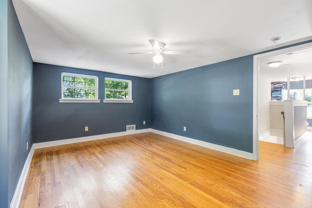 7606 Westwood Ave, Little Rock, AR 72204 - spare room featuring light wood-type flooring, a ceiling fan, and baseboards