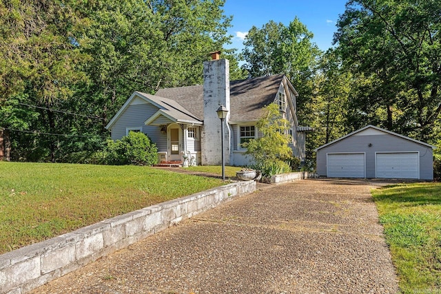 7606 Westwood Ave, Little Rock, AR 72204 - view of front of home featuring a garage, an outbuilding, a chimney, and a front yard