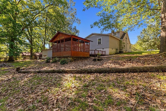 7606 Westwood Ave, Little Rock, AR 72204 - rear view of property featuring a wooden deck and central AC unit
