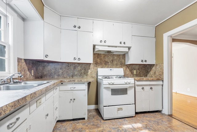 7606 Westwood Ave, Little Rock, AR 72204 - kitchen with white gas range oven, under cabinet range hood, a sink, white cabinets, and ornamental molding