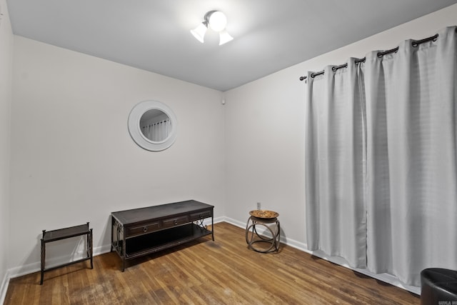 misc room with wood finished floors and baseboards