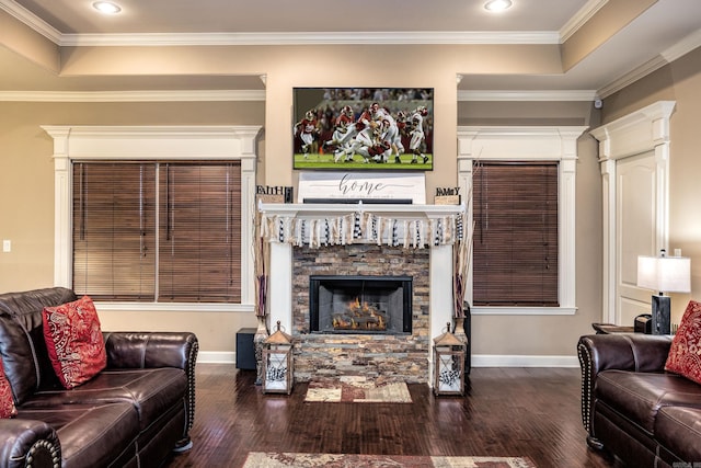 living room featuring a fireplace, wood finished floors, baseboards, ornamental molding, and recessed lighting