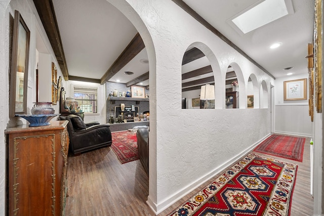 120 Sanson Pl, Hot Springs, AR 71913 - corridor featuring a textured wall, wood finished floors, baseboards, and a skylight