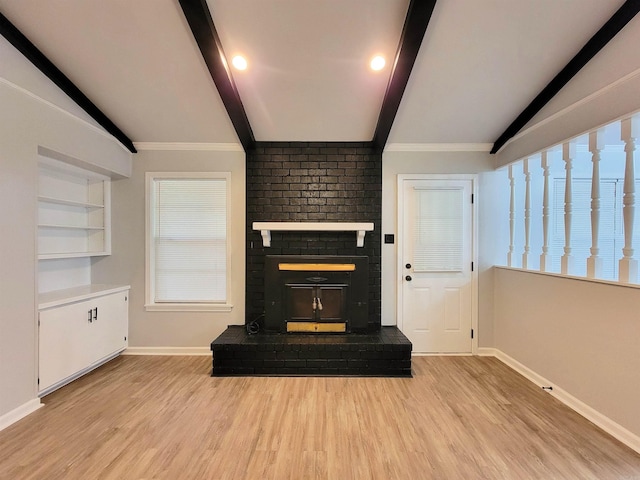 1907 Sunset, Pine Bluff, AR 71603 - unfurnished living room featuring baseboards, wood finished floors, a fireplace, and plenty of natural light