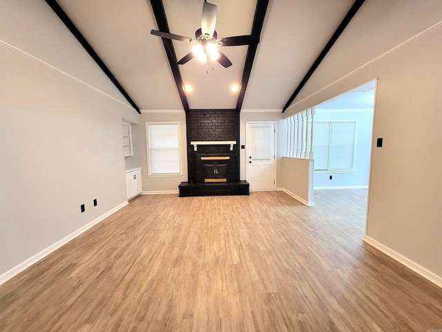 1907 Sunset, Pine Bluff, AR 71603 - unfurnished living room featuring ceiling fan, a fireplace, baseboards, and light wood-type flooring